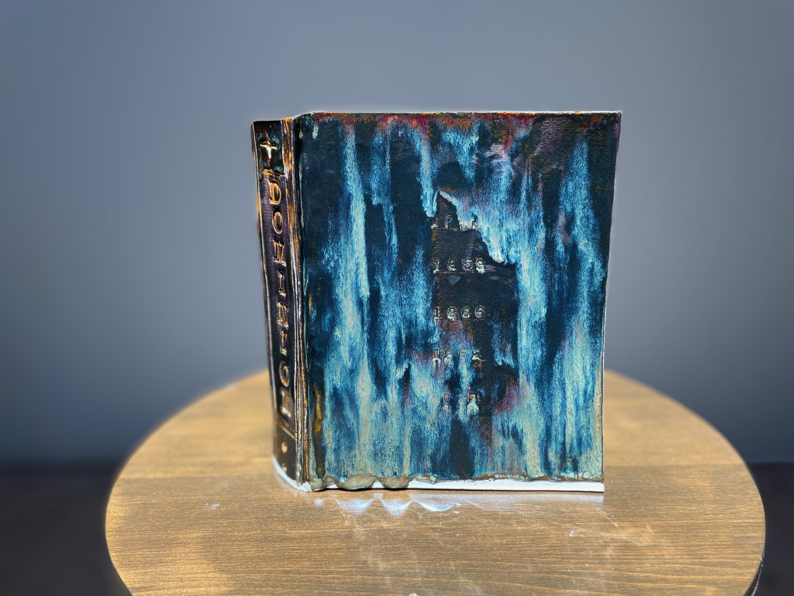 Dan Nuttall's ceramic sculpture of a book titled "Dominion"